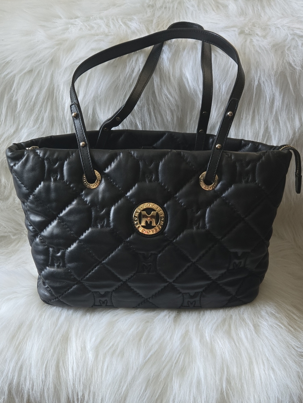 Quilted Black Tote with Gold Medallion Accent